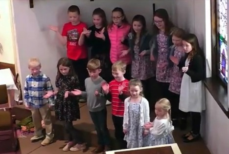 Image of kids singing at church.