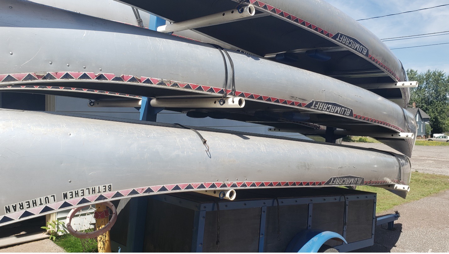 Image of canoes on a trailer.