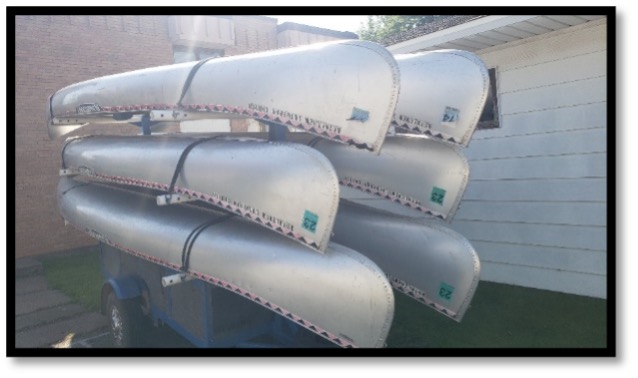 Image of canoes in a rack.